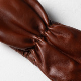 Detailed stitching and full-grain genuine leather texture on golf driver headcover.